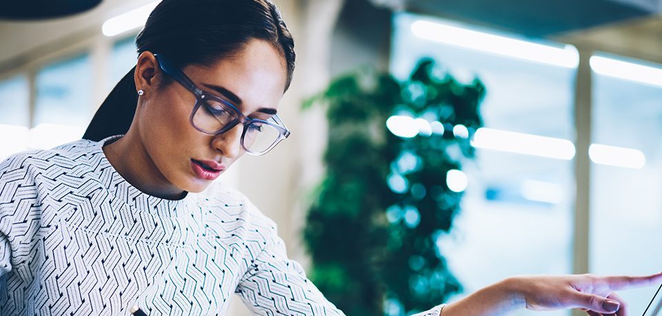 woman looking at a screen working