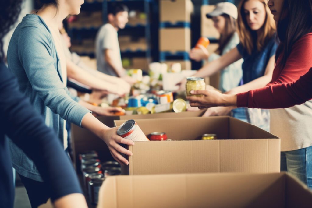 A group of unrecognizable people volunteering at a local food bank showcasing compassion generosity and community service, FoodBank Helpers