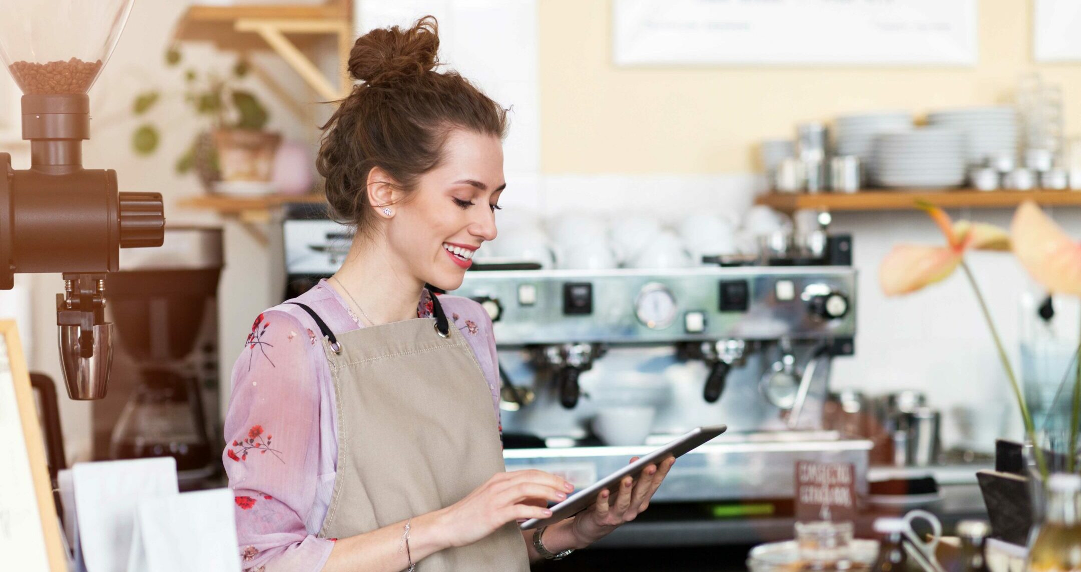 Young,Woman,Using,Digital,Tablet,In,Coffee,Shop Young woman using digital tablet in coffee shop