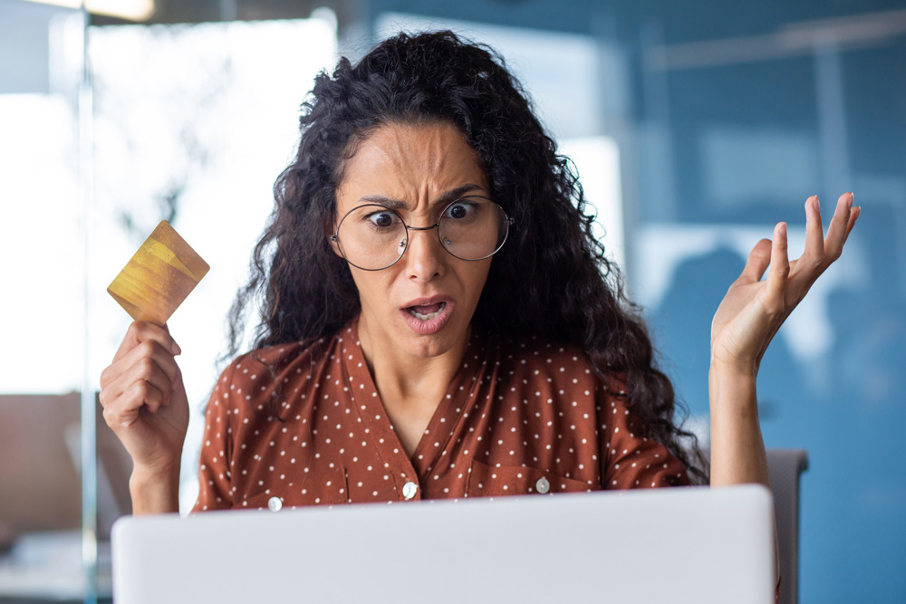 upset-and-shocked-business-woman-with-bank-credtcard